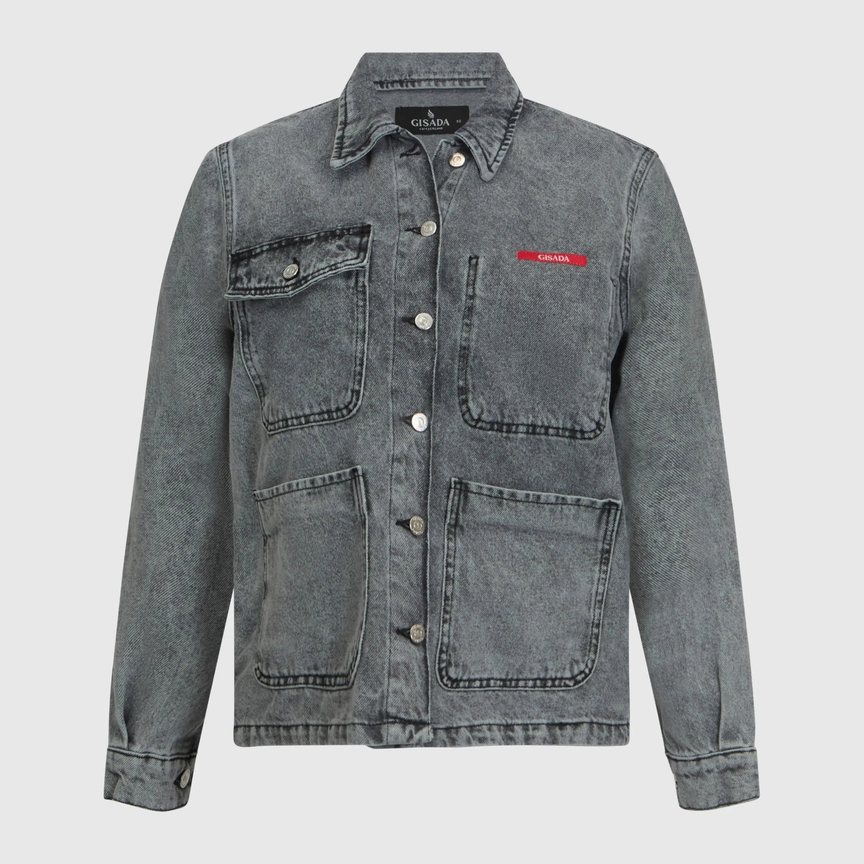 Close-up of chest with Gisada red logo patch on denim fabric