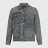 Close-up of chest with Gisada red logo patch on denim fabric